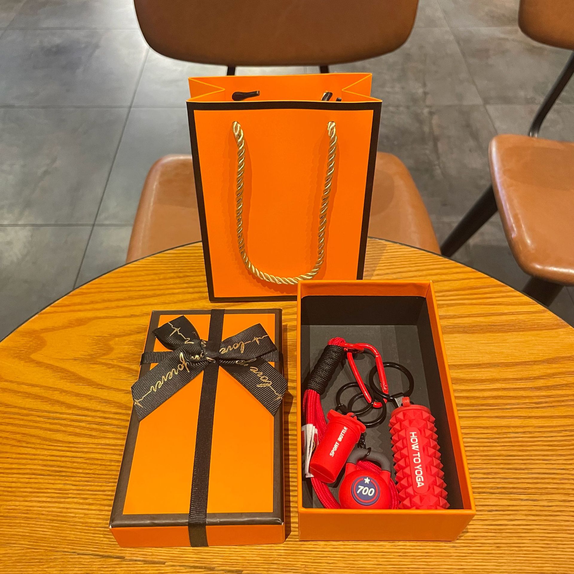 Red set for yoga from foam, orange gift box
