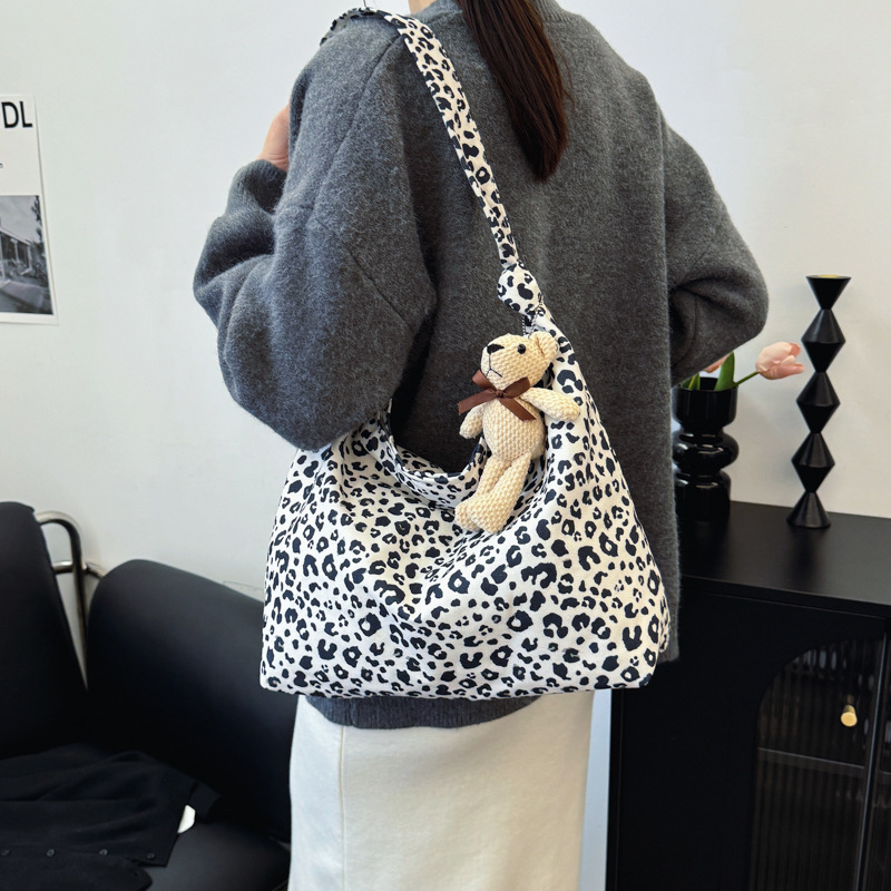 Estudiantes universitarios clase de viaje bolsa de gran capacidad para mujeres 2024 nueva moda extranjera leopardo tela mochila