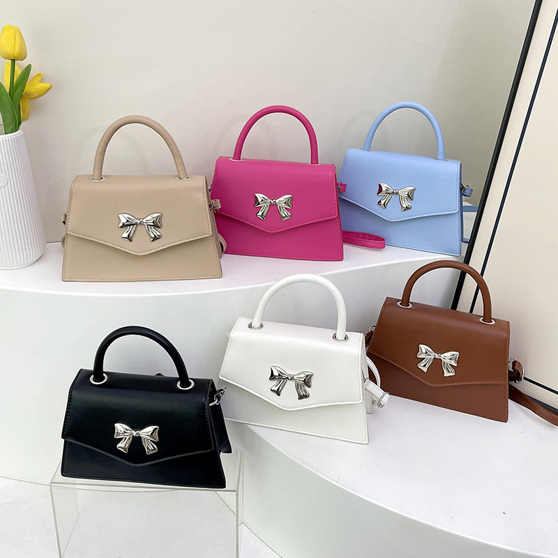 Arco de moda de verano 2025 hermoso nuevo estilo ocio de estilo extranjero suave portátil de hombro mochila pequeña bolsa de mujer