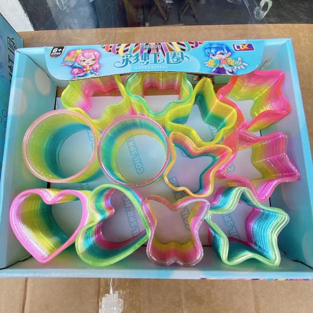 Juguetes para niños anillo de arco iris de forma especial anillo elástico bobina anillo superpuesto regalo para jardín de infantes para niños y niñas puzzle