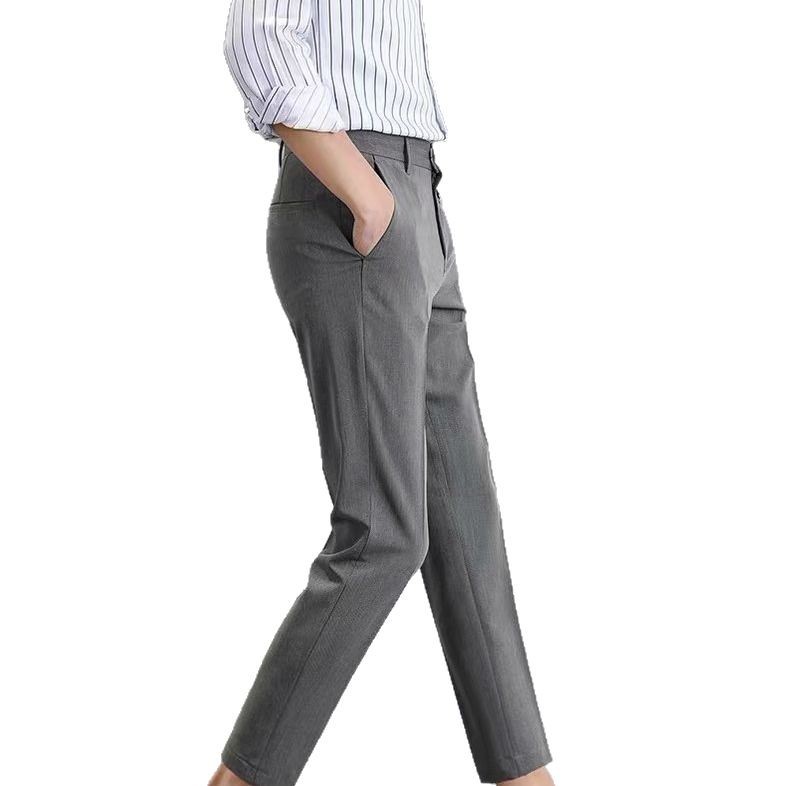 Los fabricantes de origen pantalones pequeños negros pantalones cortos para hombres, pantalones de traje ajustados rectos con sentido de tendencia, pies pequeños, versión coreana casual