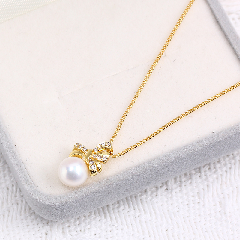 Ciondolo a fiocco con perla placcato oro per donna elegante_voghion.com