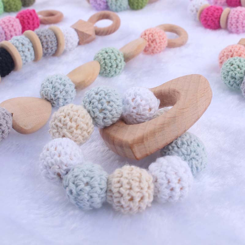 Nueva historieta del bebé haya amor mordedor juguete DIY macaron gran bola de lana mordedura pulsera