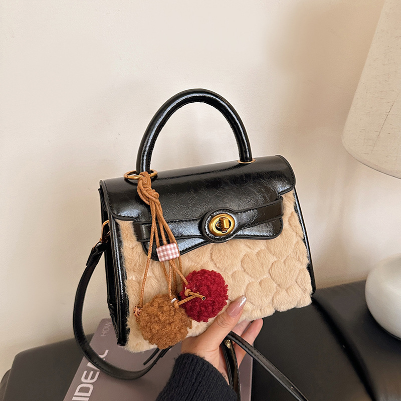 Otoño y invierno de alto nivel bolso de lana portátil para mujeres 2025 nuevo nicho Zhong commuting bolso de hombro bolso casual Kelly