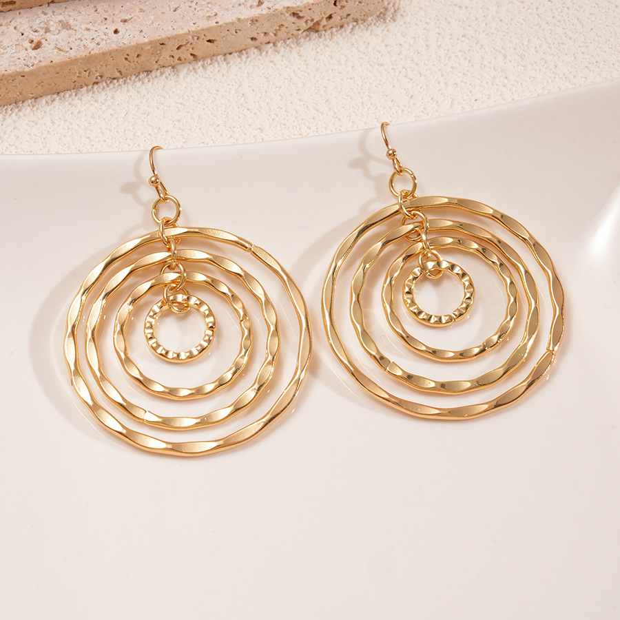 Europa y los Estados Unidos transfronterizos huecos redondos ganchos de orejas de geometría de tornillo de metal de alta calidad industria pesada personalidad única nicho pendientes mujeres