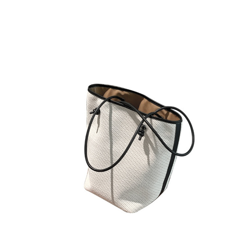 Vacation style leisure large capacity single shoulder tote 2024 new simple commuting big women's bucket baozi mother bag_voghion.com