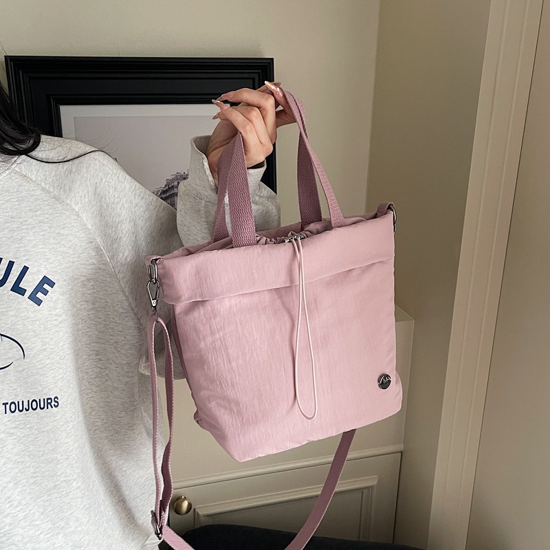 Bolso de lona para mujer 2025 nuevo bolso de cubo ligero y casual bolso de hombro portátil bolso de mensajero deportivo de fitness de gran capacidad