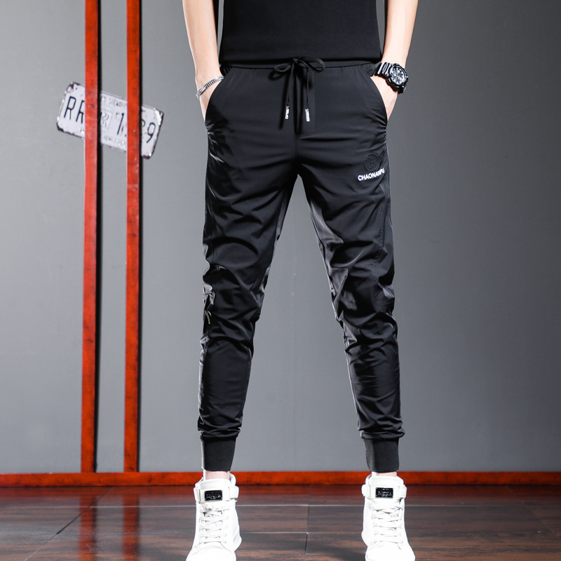 2023 Summer Light Luxury Embroidered Ice Silk Slide Black Casual Sports Pants Men's Summer Thin Slim-fit Small Foot High-end Speed