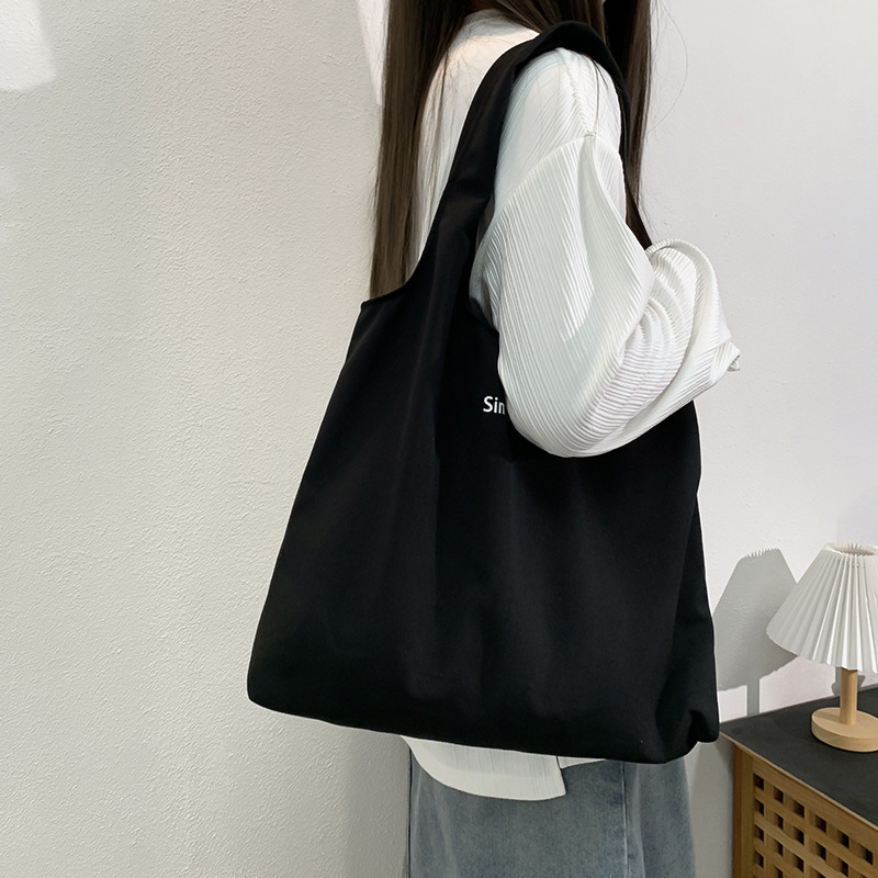 秋冬キャンバスバッグ黒色アルファベットベストバッグ大容量旅行休暇バッグ学生授業バッグバッグショッピングバッグ