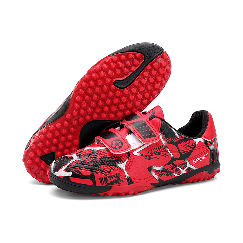 Niños y niñas transfronterizos transpirables cómodos deportes ociosos bajos clavos de clavos de hierba competición zapatos de fútbol de fábrica para niños