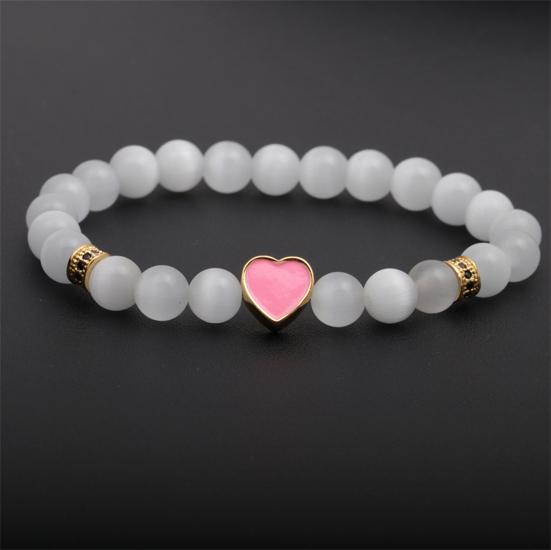 Las mujeres europeas y americanas transfronterizas Opal pulsera de amor con cuentas de cobre micro-incrustaciones de aceite de gota en forma de corazón pulsera de pareja de mujeres