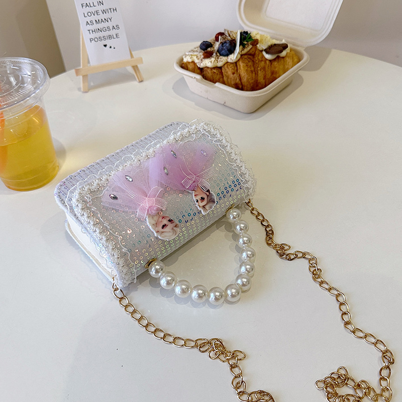 2025 nuevo lindo arco princesa bolsa de perlas portátil moda versátil mochila de hombro bolso de cambio coreano