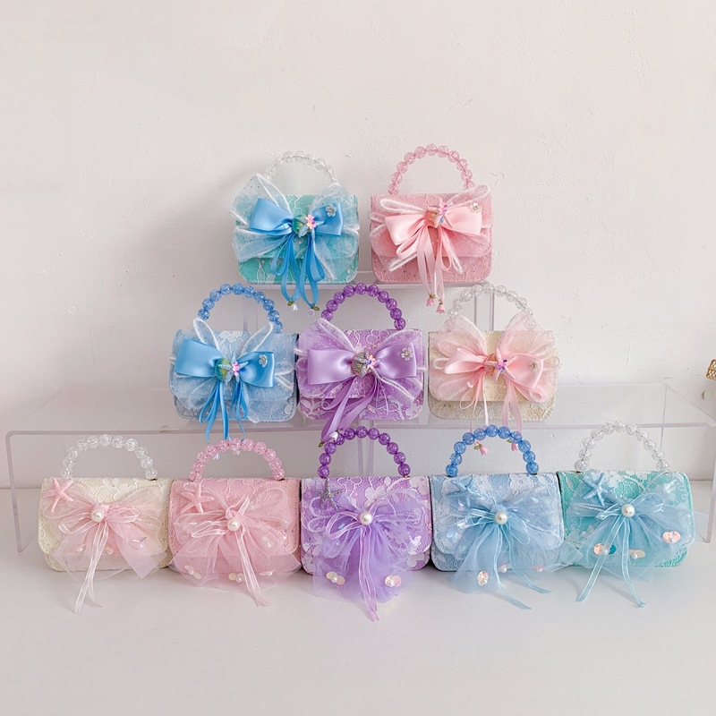 Bolsa de niños arco dulce, bolso de hombro portátil de niña, mini lindos bolsos de cadenas para hombres y mujeres.