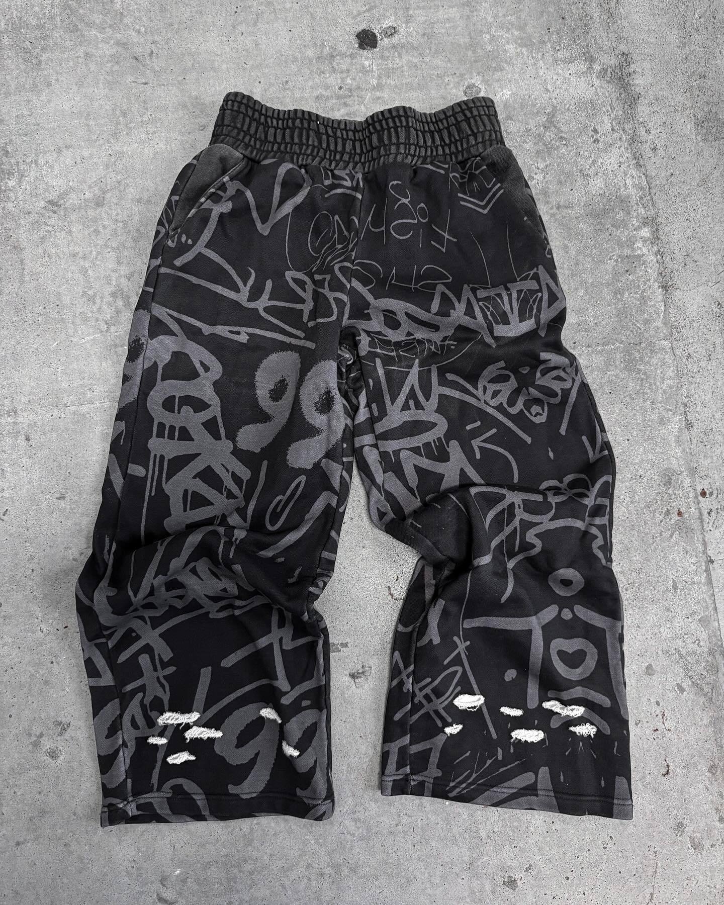 2025 sentido de diseño otoño y invierno Europa y Estados Unidos transfronterizos moda callejera relajada hip hop tendencia nuevos pantalones largos
