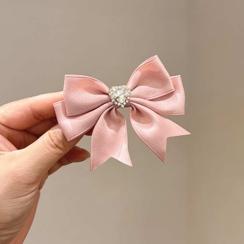 Розовая заколка для волос с бантиком