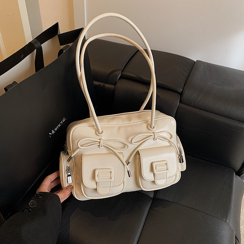 Bolsa de brazo coreana de arco de gran capacidad de moda extranjera bolso de hombro de viaje diario bolso de nicho de diseño