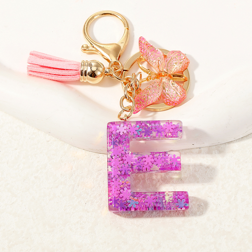 Nuevo color púrpura claro mezcla de polvo brillante letras inglesas resina llave colgante estilo simple mariposa borda colgante