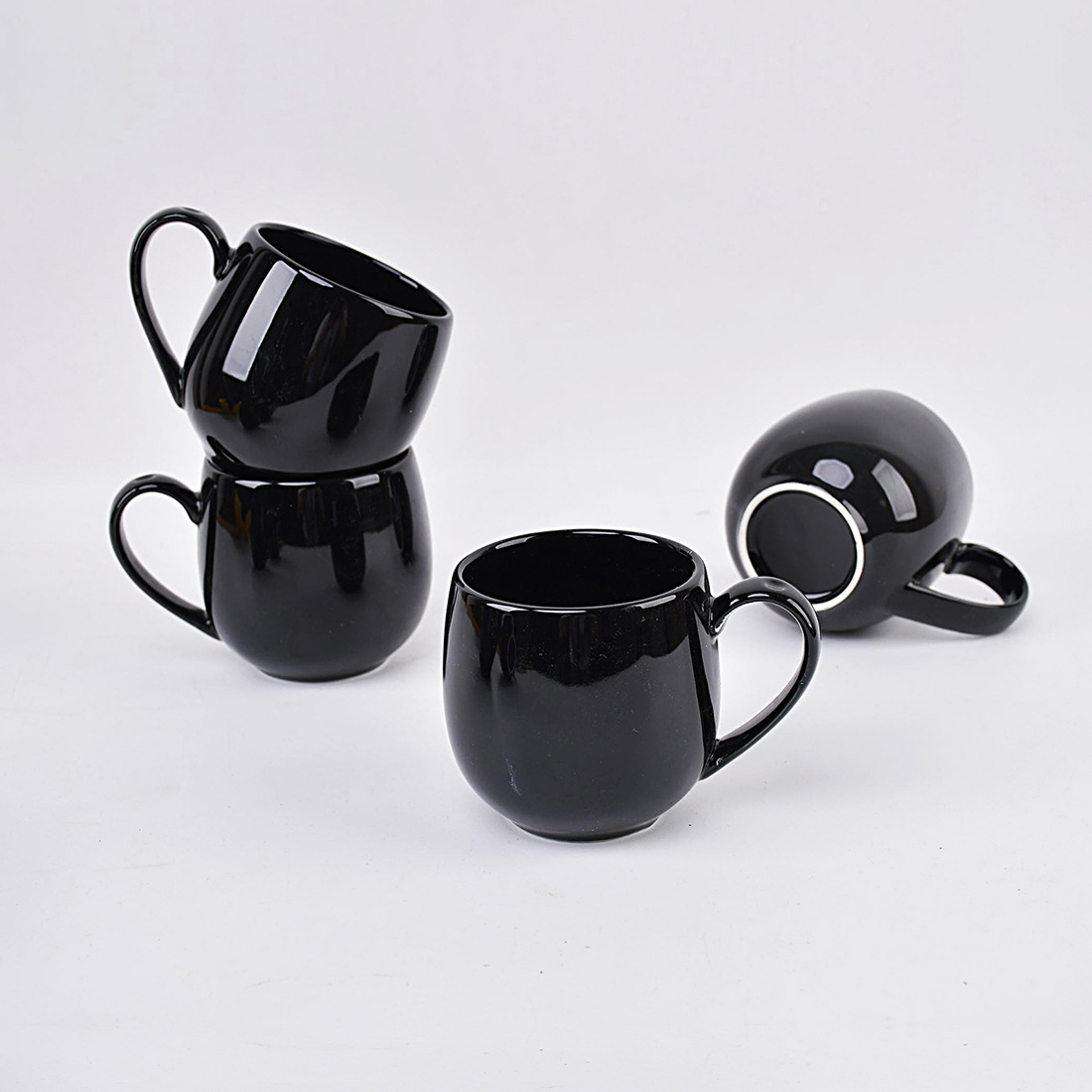 black A set of four six ceramic mugs for hot beverages