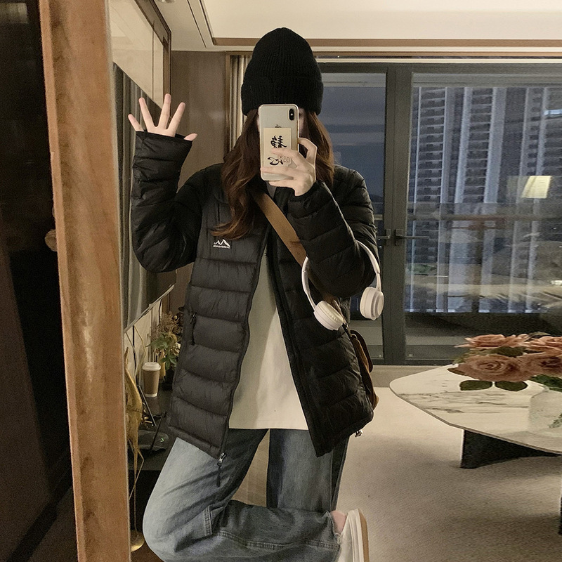 Invierno ligero encapuchado chaqueta de algodón para mujeres 2025 nuevo estilo coreano para vestir con abrigo de algodón caliente y grueso