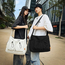 单肩包男斜挎包帆布邮差包2025新款时尚旅行运动休闲挎包工装背包