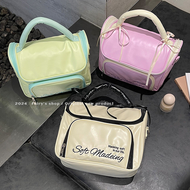 Handheld capacious cosmetic bag with bow to go out