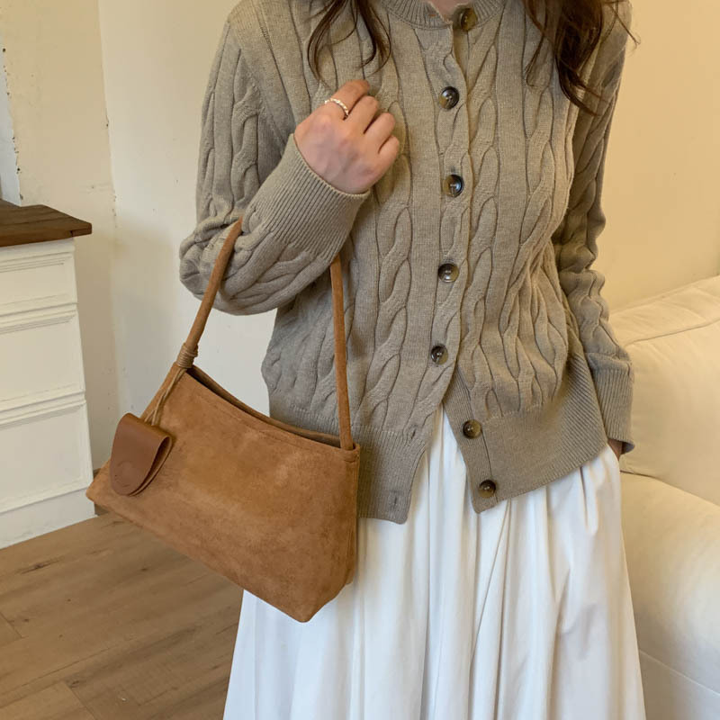 Niche de alta sensación de seda de abrigo bolso inferior para mujeres otoño / invierno 2025 nueva moda de moda universal bolso de mano de viaje