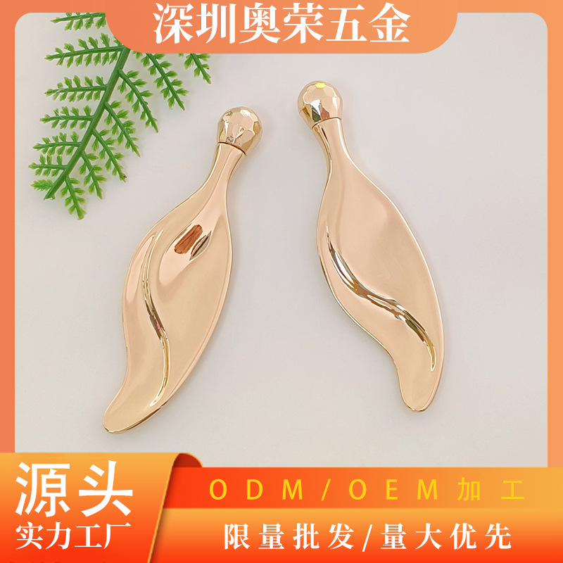 Nuevo masajeador facial en stock, mini raspador tipo hoja de aleación de zinc, herramienta metálica para masaje facial