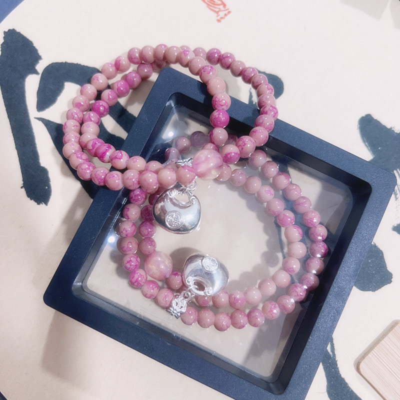 Bracciale con perline rosa e ciondolo portafortuna donna_voghion.com