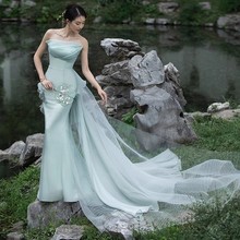影楼情侣户外婚纱照摄影服装新中式复古园林拍照写真绿色超仙礼服
