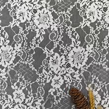 新款现货满幅提花网布蕾丝布料镂空无弹涤纶消光窗帘家纺服饰面料