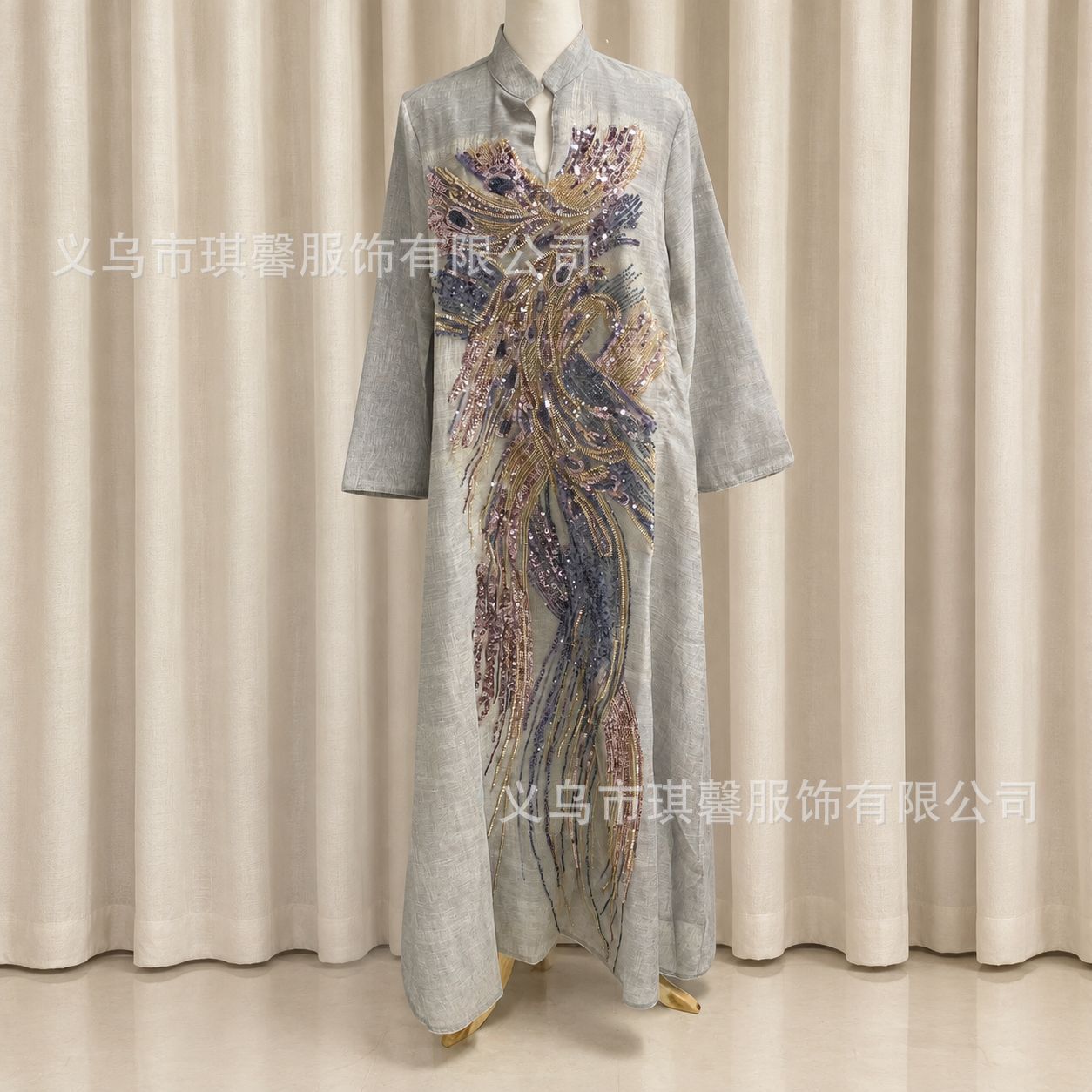 New robe with elaborate bead and sequin embellishments from the bodice to the hem, featuring a heavily patterned print