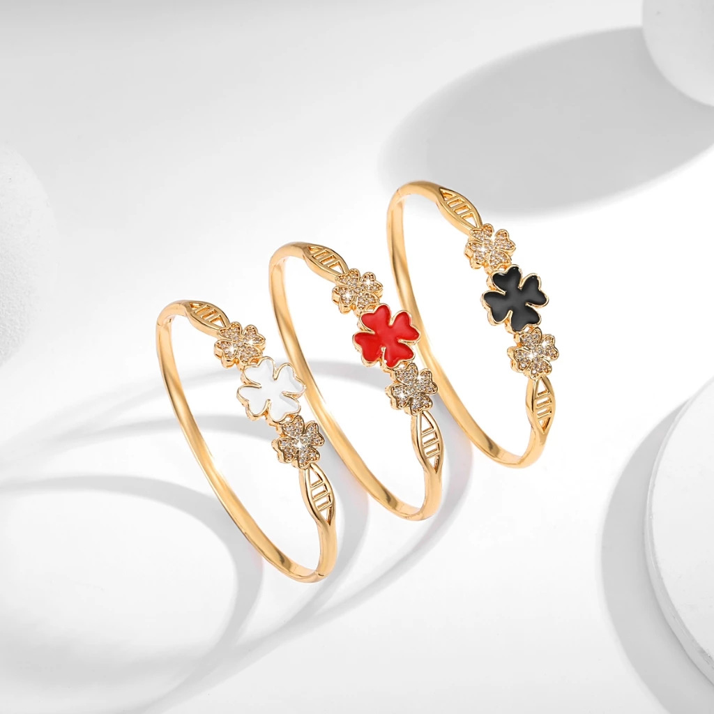 Joyas explosivas transfronterizas, brazalete abierto de trébol de cuatro hojas chapado en oro, sentido de diseño, pulsera de trébol de cuatro hojas con incrustaciones de circón, joyería para mujer