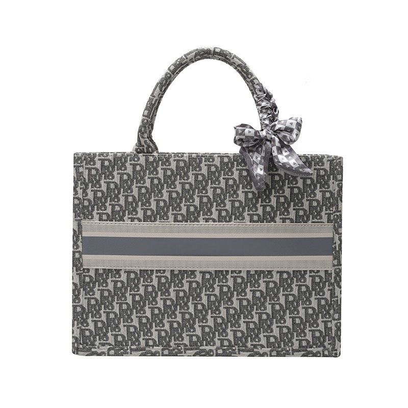 Bolsos bordados de alta calidad para mujeres 2026 nuevas letras de tela transfronterizas retro bolsas de mano de transporte de gran capacidad