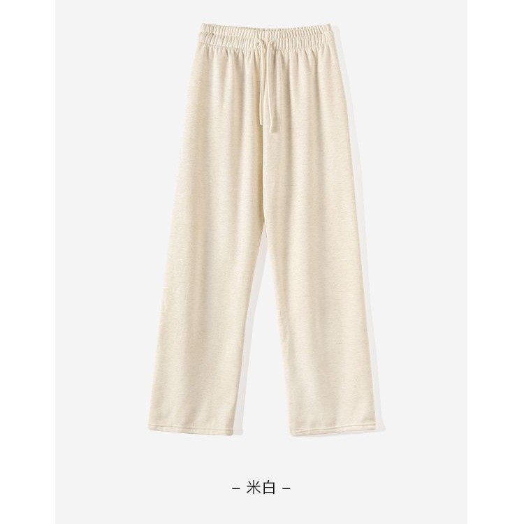 狭い版のもち米のズボンの女性の秋冬の杏色のベルベットの高い腰の垂れ下がった感じのゆったりしています。