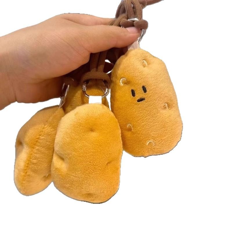 Harbin sur pequeña patata peluche colgante bolsos muñecas muñecas lindas muñecas máquina peluche al por mayor chirrido