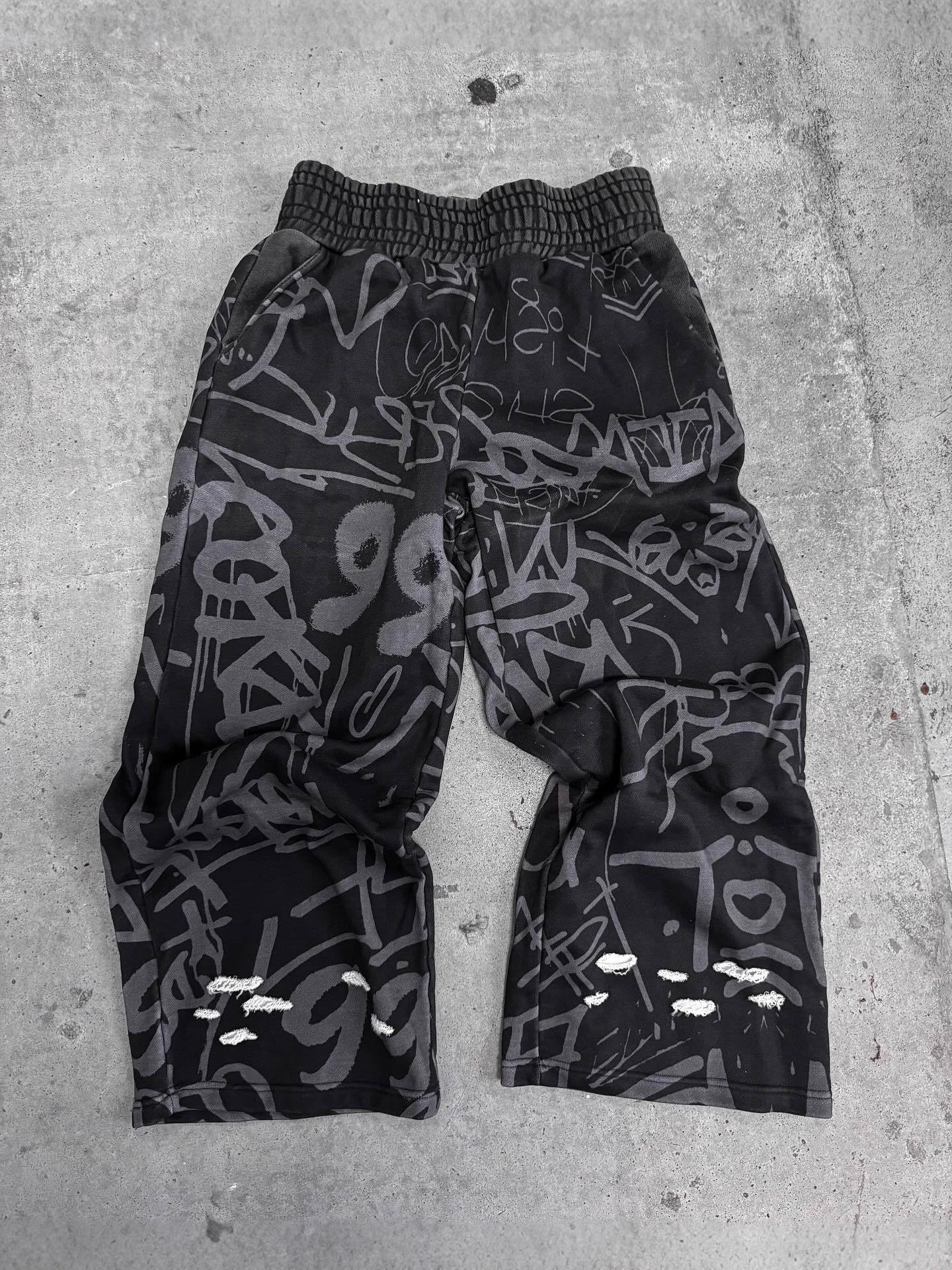 2025 sentido de diseño otoño y invierno Europa y Estados Unidos transfronterizos moda callejera relajada hip hop tendencia nuevos pantalones largos