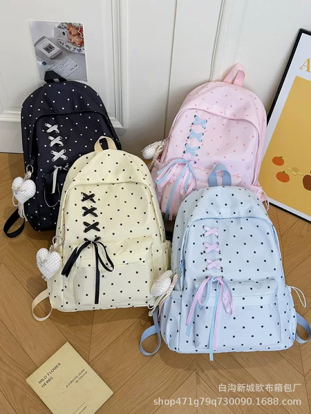 Highly stylish polka dot backpack for junior high school girls, with bow tie, large capacity, trendy and unique, lightweight school backpack