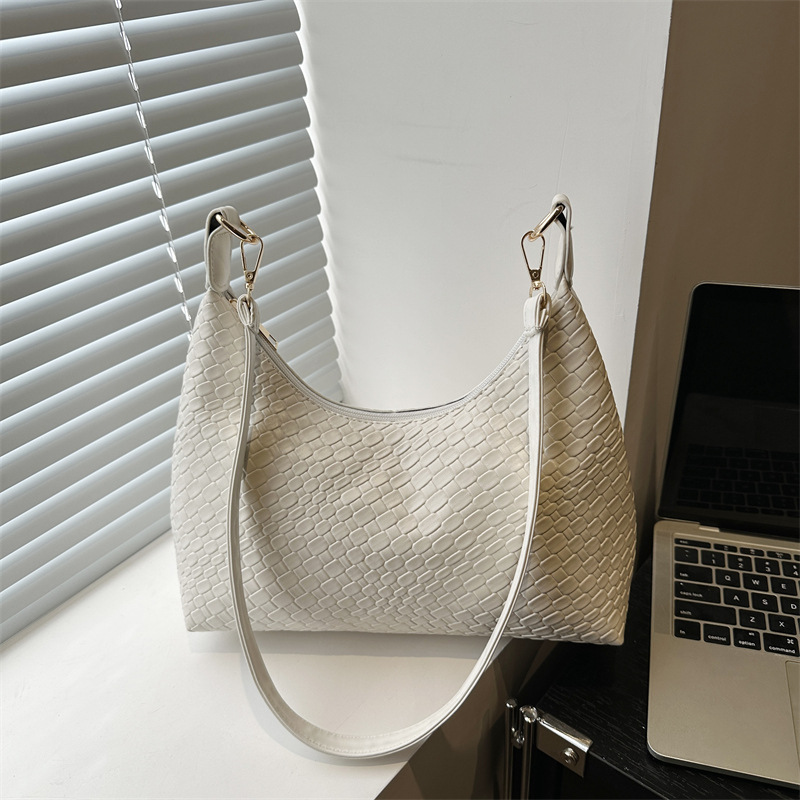 Moda popular tejido de cercanías 2025 nueva gran capacidad diseño casual simple axila bolso portátil