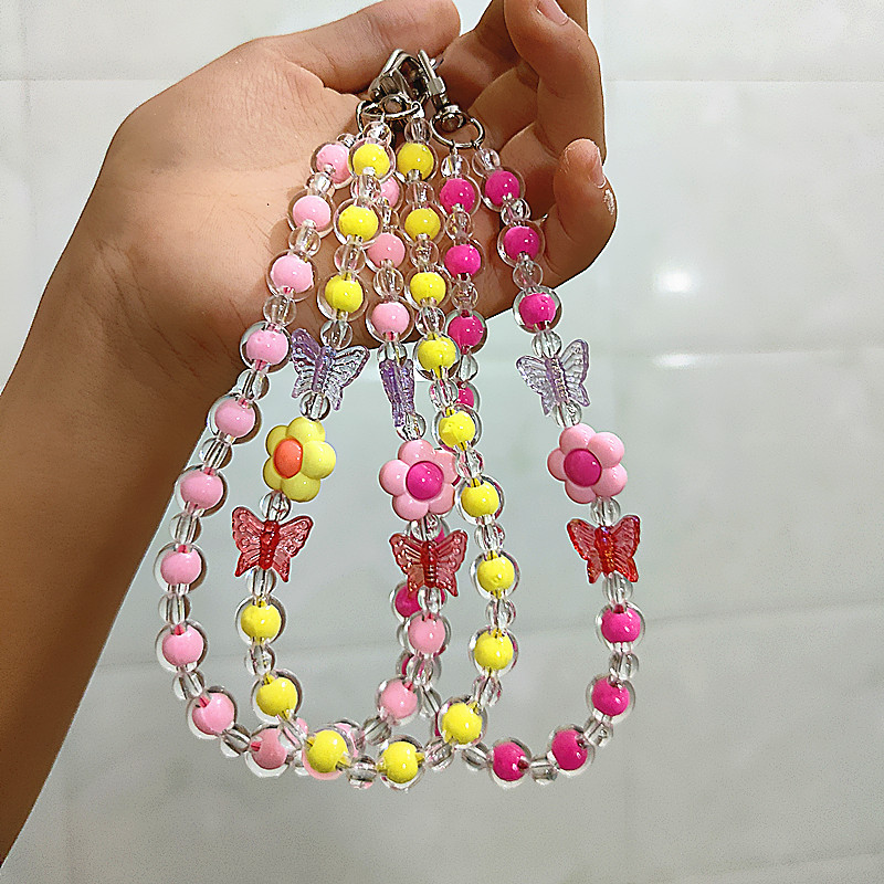 Flor Mariposa Caja del teléfono móvil Cadena con cuentas Douyin Bolso en vivo Auriculares Llavero Macaron Colgante Accesorios Cuerda