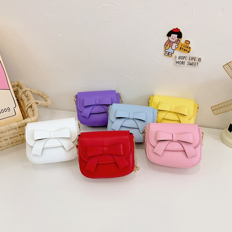 Bolsos de hombro de princesa de color sólido mini lindos bolsos de arco para niñas 2025 nuevos bolsos de cadenas para niños