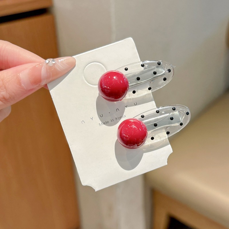 1 clip de perlas rojas