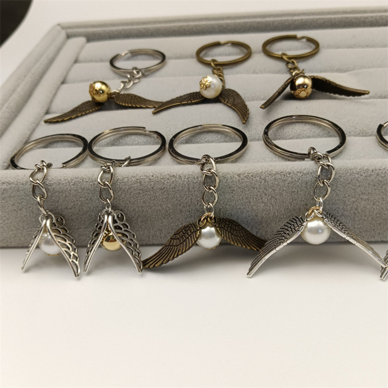 Fashion Hip Hop Retro Harry Potter Movie Golden Snitch Round Ball Wings Keychain Pendant Jewelry Accessories Wholesale Fashion Hip Hop Retro Harry Potter Movie Golden Snitch Round Ball Wings Keychain Pendant Jewelry Accessories Wholesale