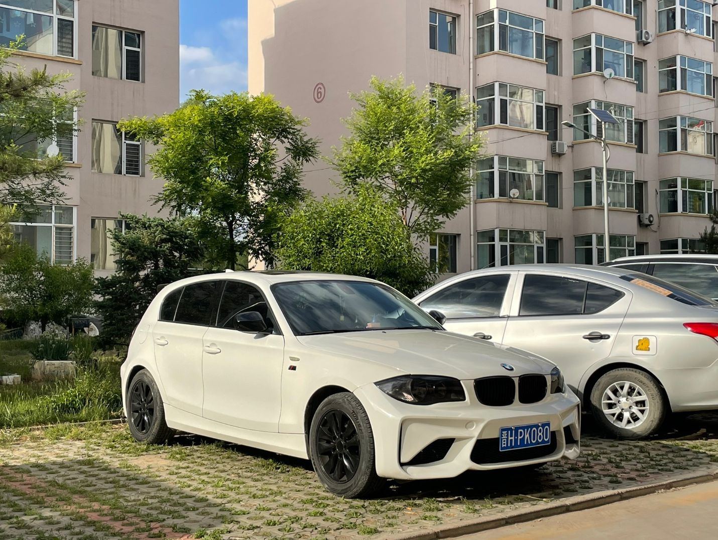 BMW 1 Series E82/E87 modified to M2 style with large body kit, front bumper and rear bumper modified for BMW