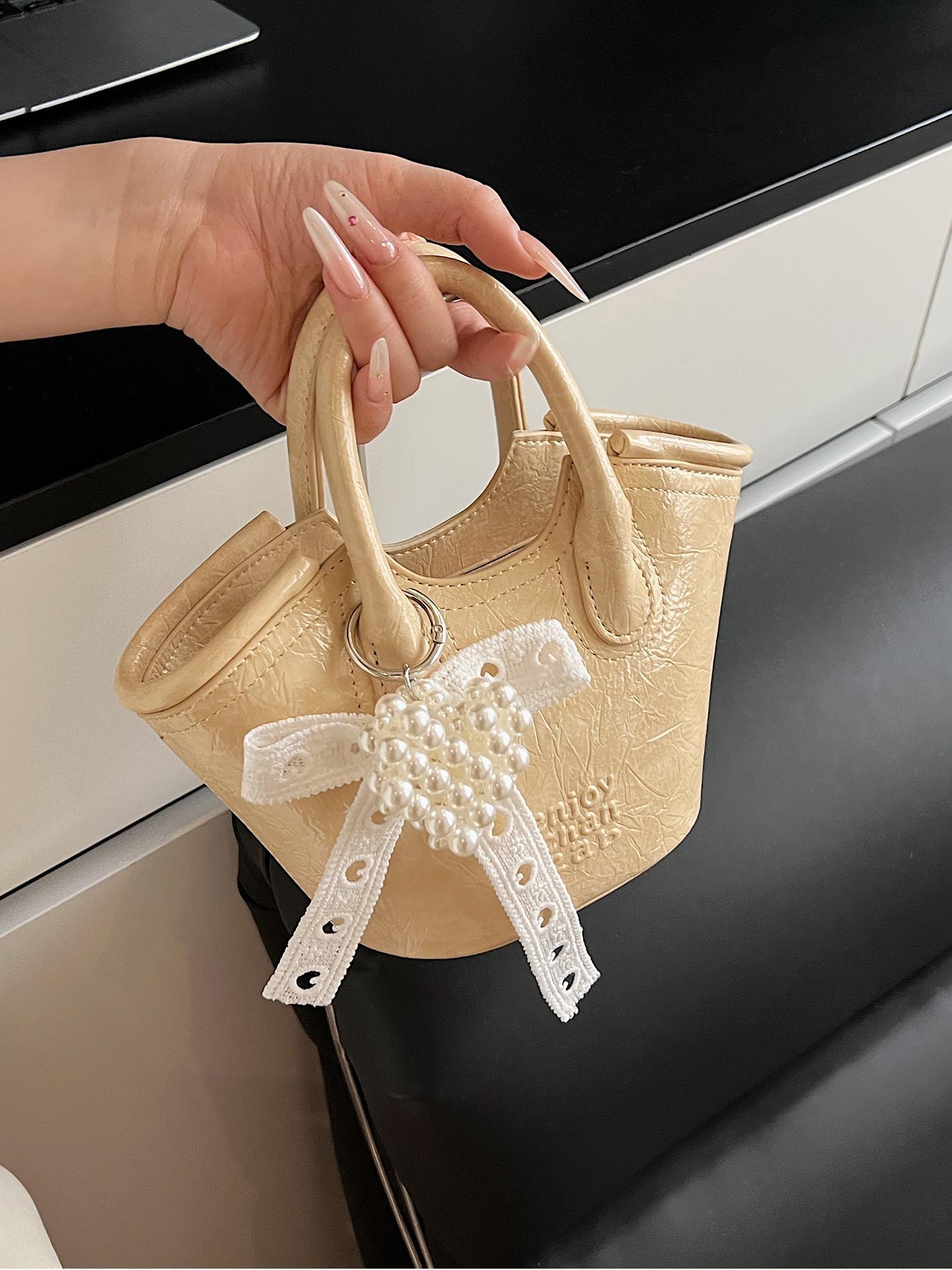 Bolso de cubo de mano de nicho de comercio exterior 2025 nuevo producto bolso de mensajero de moda casual de todo fósforo bolso de hombro de viaje de trabajo de moda