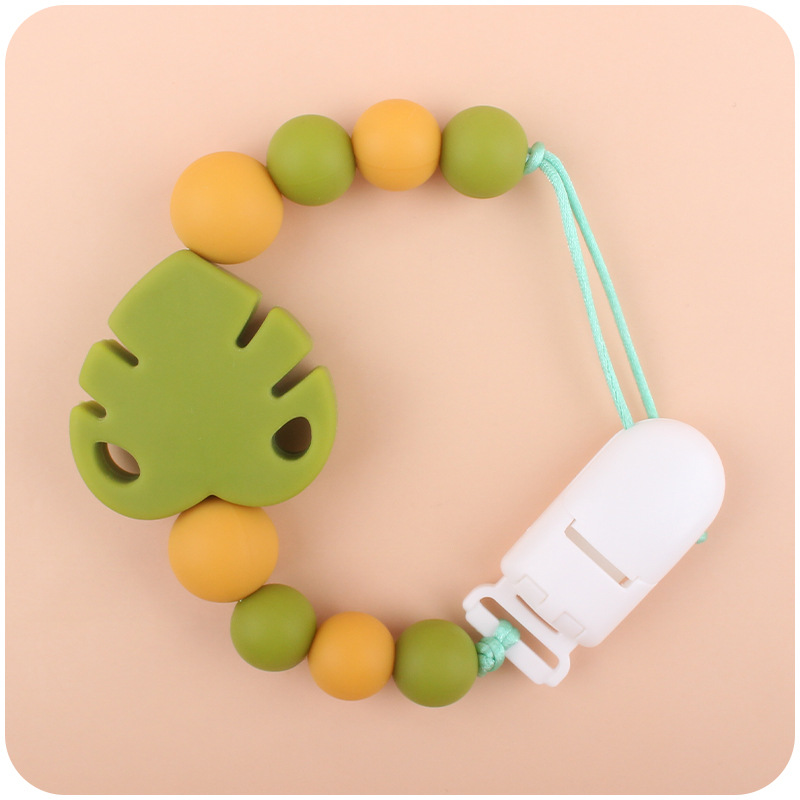 Suministros para bebés chupete cadena creativa bebé dibujos animados hojas silicona mordedura cadena anti-gota molar Nuevo