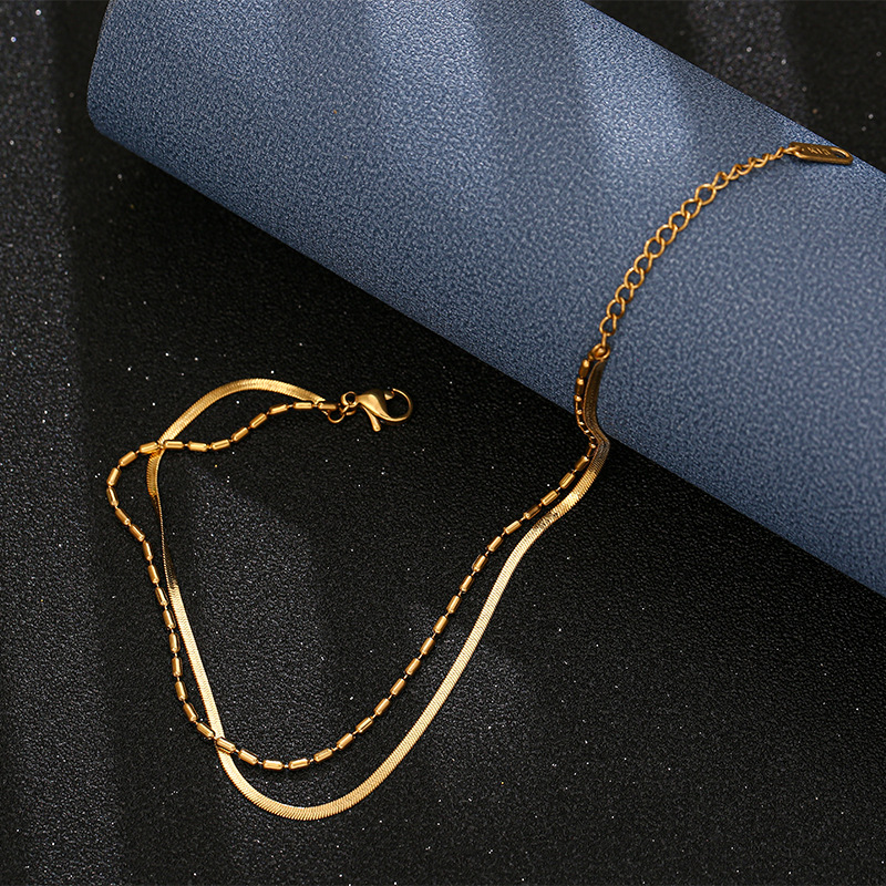 Viento frío de doble capa de hueso de serpiente tobillera de acero de titanio de las mujeres en línea popular anillo de la pierna joyería no se desvanece Accesorios de playa de las mujeres