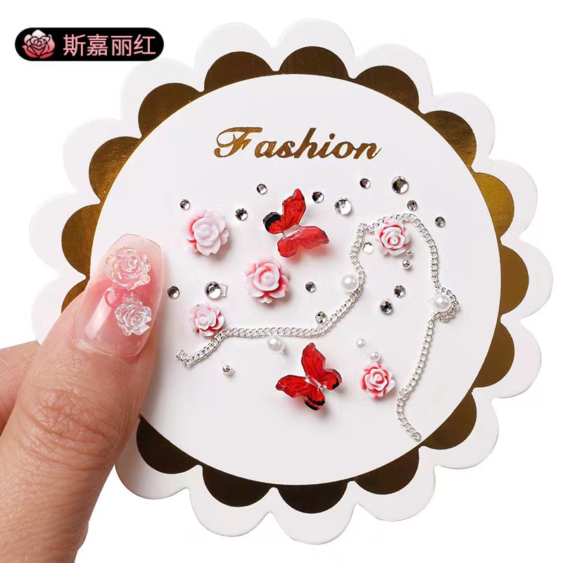 Manicure camellia material paquete de joyería pequeño libro rojo explosión arco mezcla de cadena de joyería de uñas accesorios al por mayor