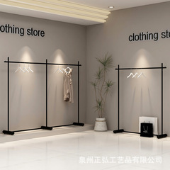 黒い服の店の展示棚の婦人服の店の床のハンガーの側は陳列棚の紳士服の陳列棚を掛けて太くなります。