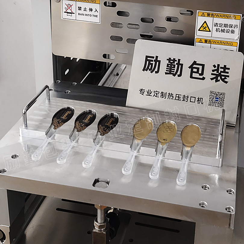 Cuchara de miel PP máquina de sellado de película de aluminio automática de equipos de sellado de tazas Liqin fábrica de embalaje de material de embalaje de apoyo venta directa