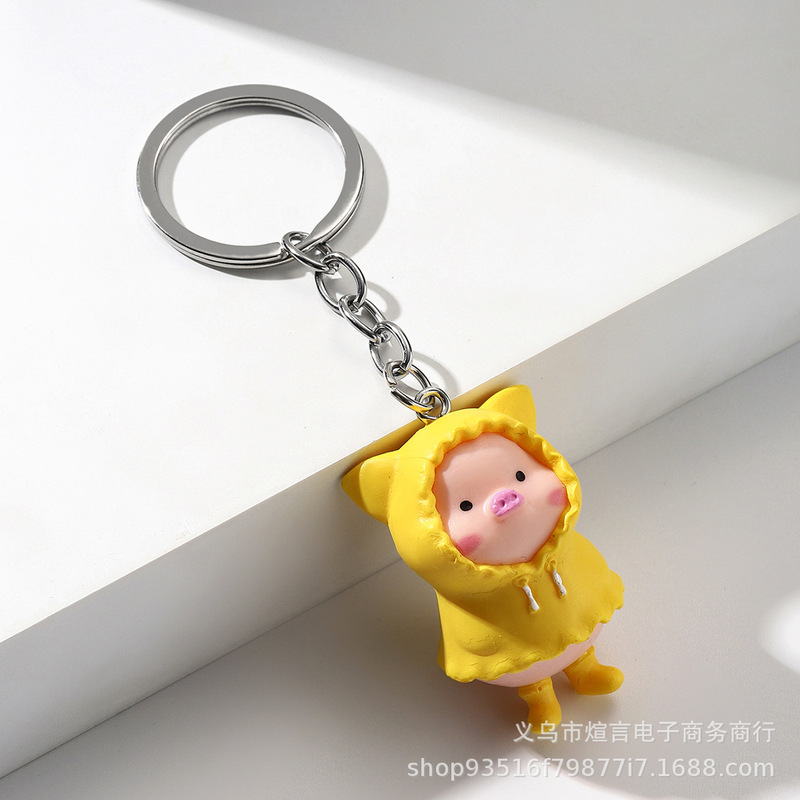 Cross-border hot creative cartoon cute raincoat pig keychain pendant bag car key pendant can be photographed